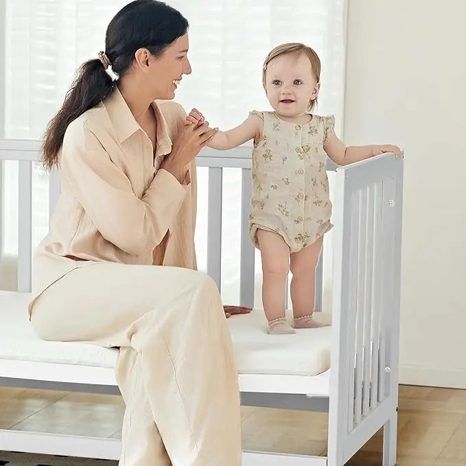 Six-In-One Portable Mini Crib With Mattress And Adjustable Height